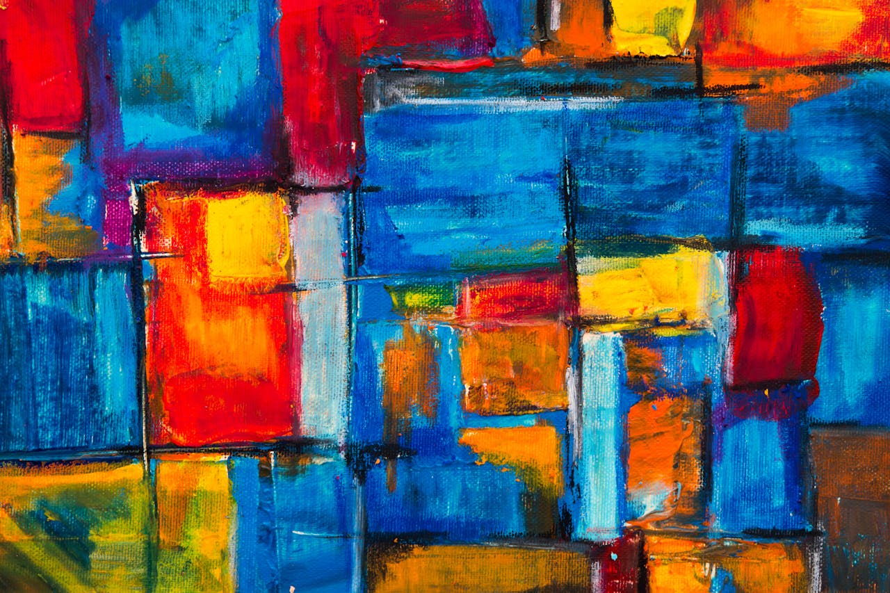 Colorful abstract painting with vivid blue, red, and yellow hues creating a dynamic composition.